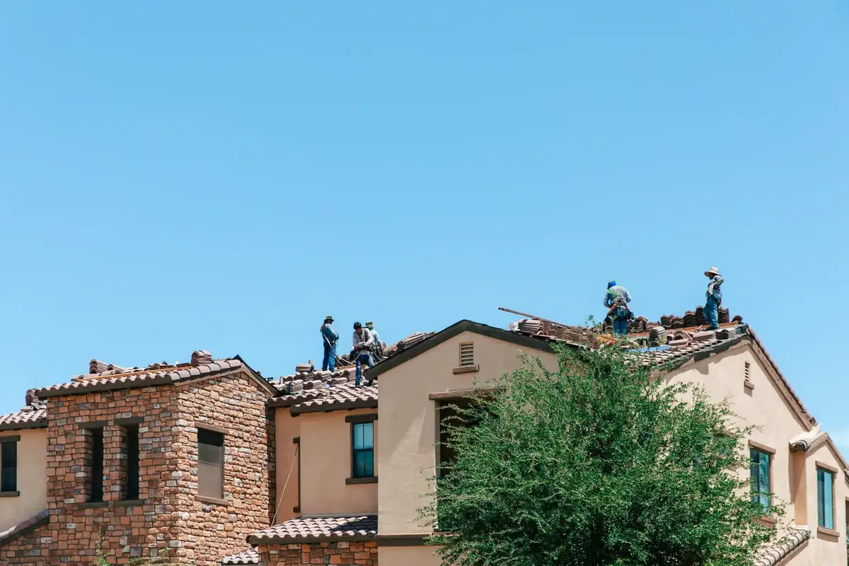 RENCO Roofing crew working on a tile roof in Phoenix